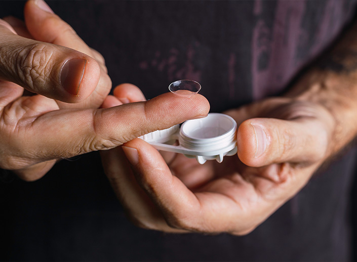 contact lens on top of finger